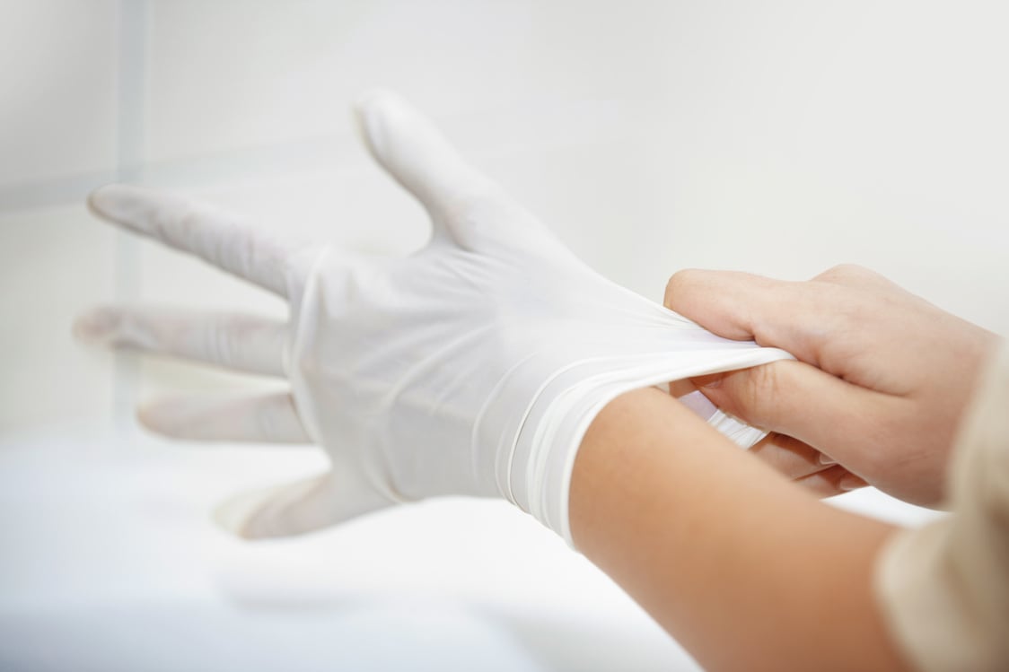 Hands Wearing White Sterile Latex Gloves Closeup